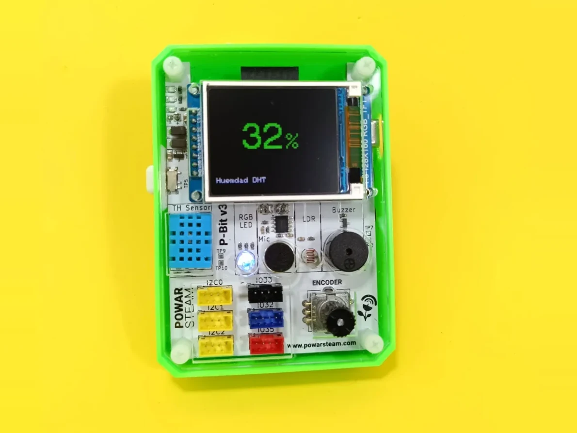 P-Bit v3 with a green case, its screen showing 32% humidity